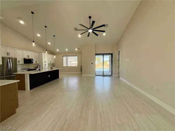 a view of kitchen with sink and wooden floor