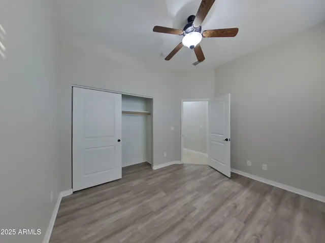 a bathroom with a glass shower door and mirror