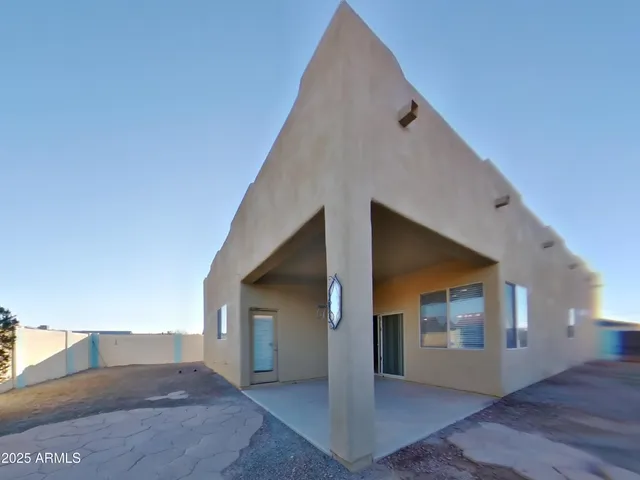 a bathroom with a tub a sink and a large mirror