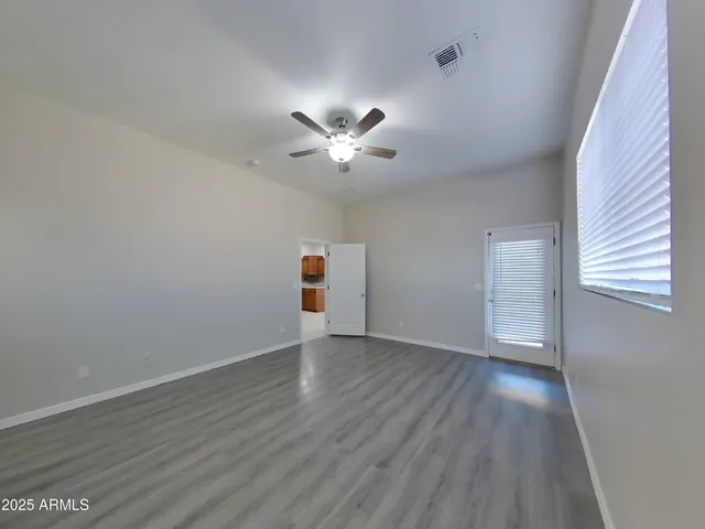 a large kitchen with kitchen island a sink stainless steel appliances and a counter top