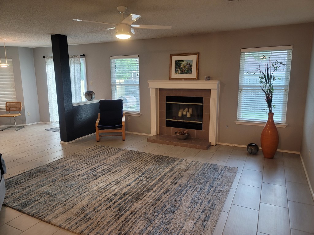 1805 Timber Ridge Drive Cedar Park, TX 78613 - Photo 2 of 25 a living room with furniture and a fireplace