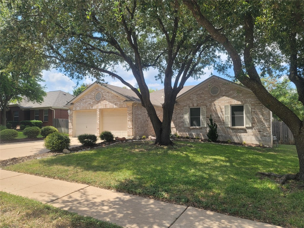 1805 Timber Ridge Drive Cedar Park, TX 78613 - Photo 23 of 25 a front view of a house with a yard
