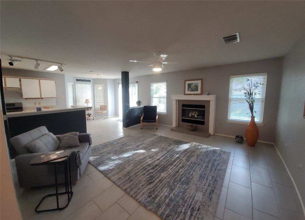 1805 Timber Ridge Drive Cedar Park, TX 78613 - Photo 3 of 25 a living room with furniture and a fireplace