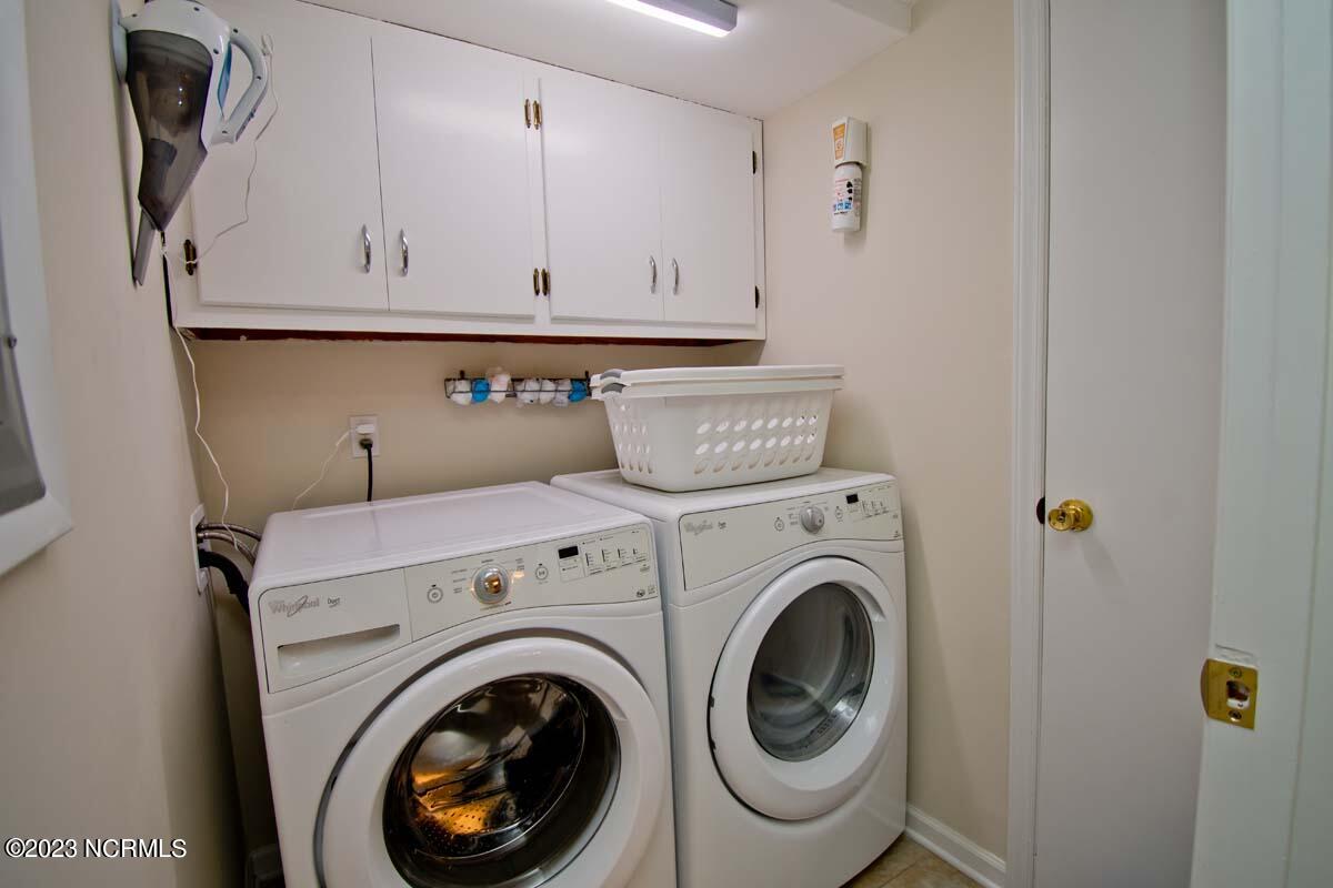 9201 Coast Guard Road, Unit B203 Emerald Isle, NC 28594 - Photo 33 of 37 laundry room/utilty storage