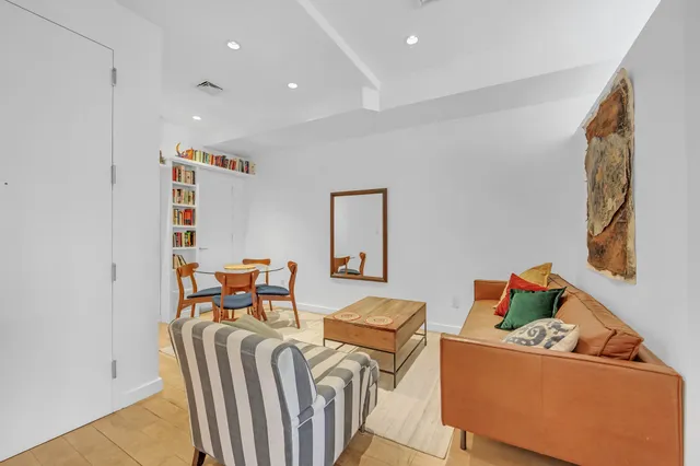a living room with furniture and a couch