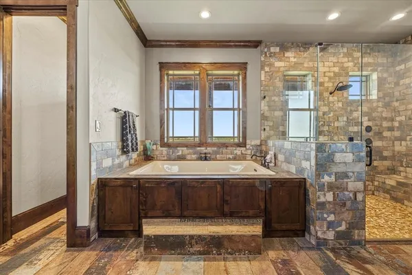 a bathroom with a glass shower door