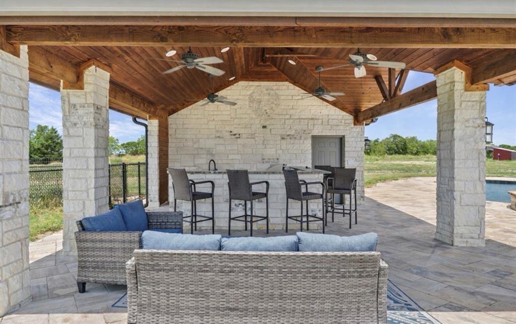 10641 County Road 632 Blue Ridge, TX 75424 - Photo 26 of 34 a living room with furniture and a floor to ceiling window