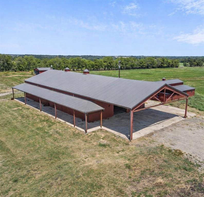 10641 County Road 632 Blue Ridge, TX 75424 - Photo 28 of 34 an aerial view of a house with porch and a yard