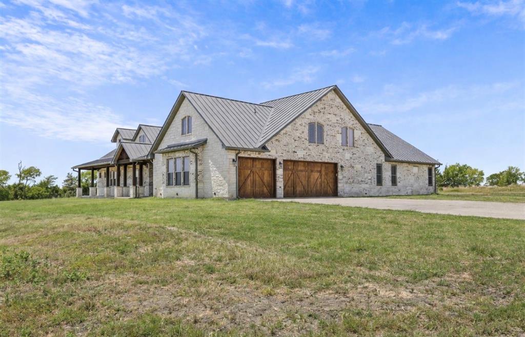 10641 County Road 632 Blue Ridge, TX 75424 - Photo 29 of 34 a front of a house with a garden and yard
