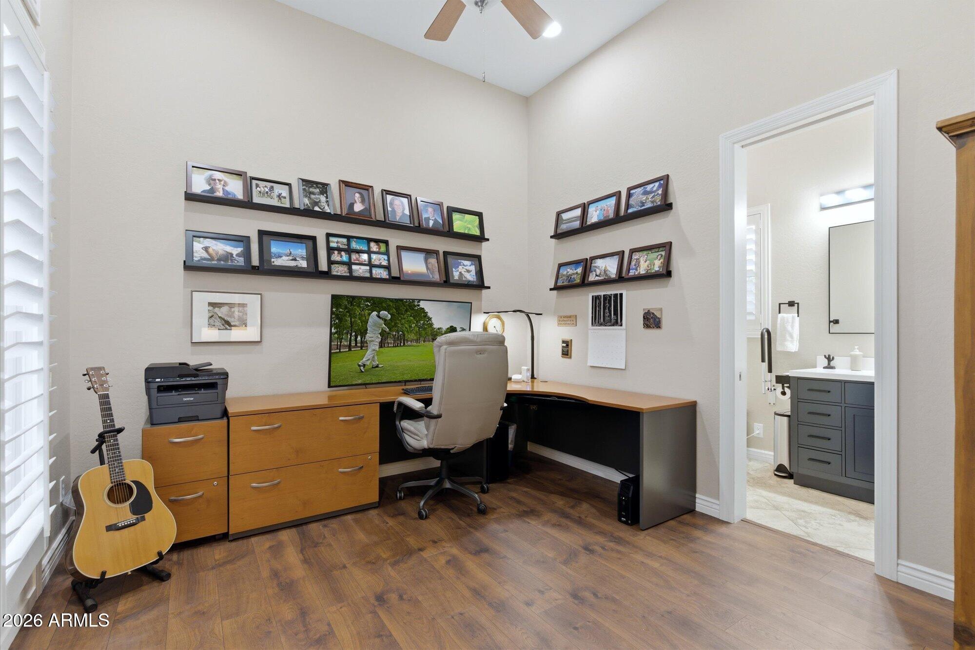 40322 North Hawk Ridge Trail Anthem, AZ 85086 - Photo 24 of 63 a view of a workspace with furniture and a bookshelf