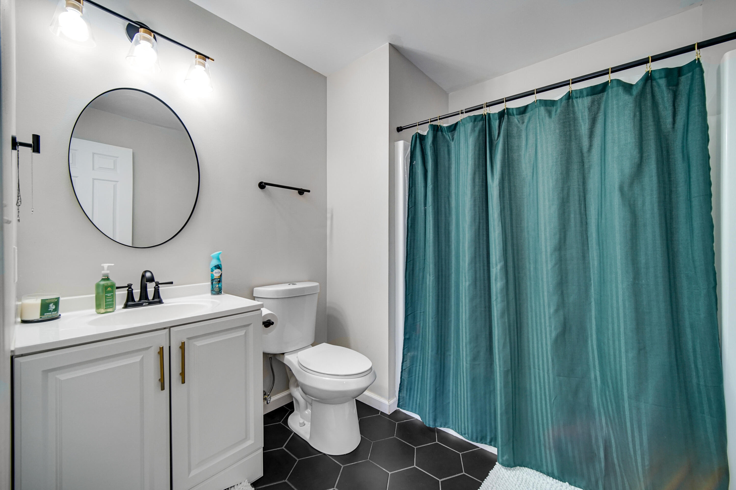 10487 Pinnacle Street Crown Point, IN 46307 - Photo 15 of 27 a bathroom with a toilet sink vanity and mirror