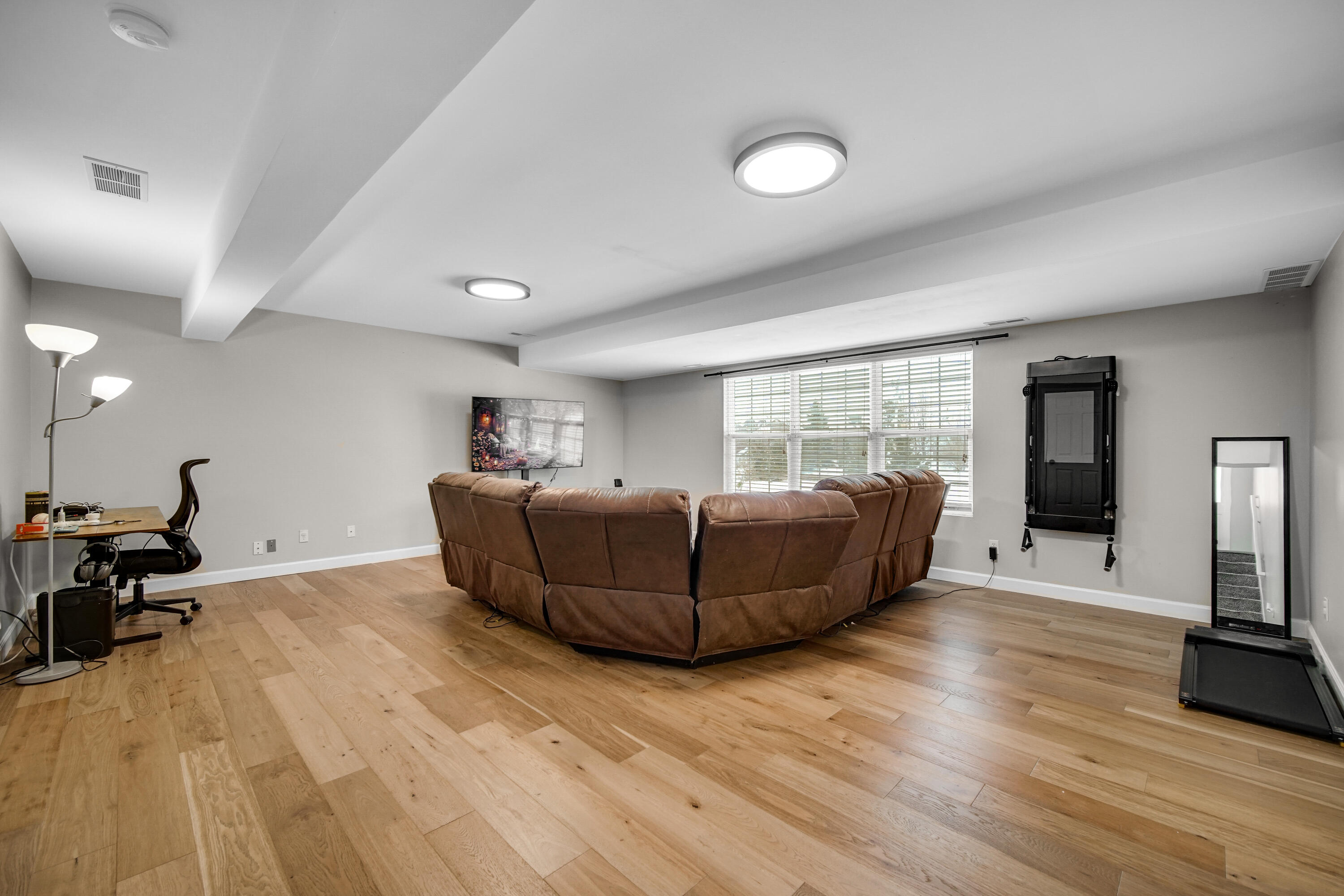 10487 Pinnacle Street Crown Point, IN 46307 - Photo 18 of 27 a living room with furniture and a flat screen tv