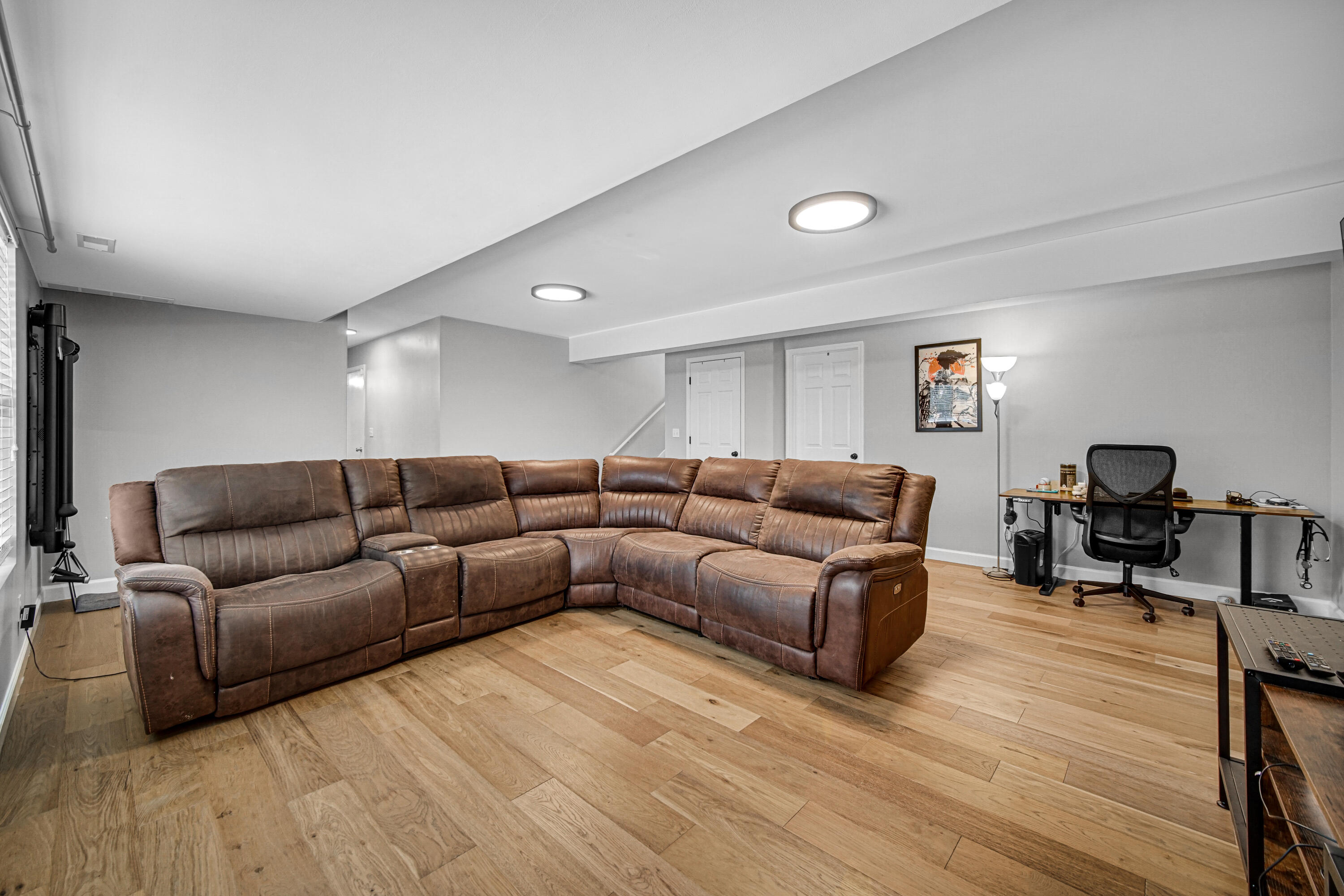 10487 Pinnacle Street Crown Point, IN 46307 - Photo 19 of 27 a living room with furniture and a wooden floor