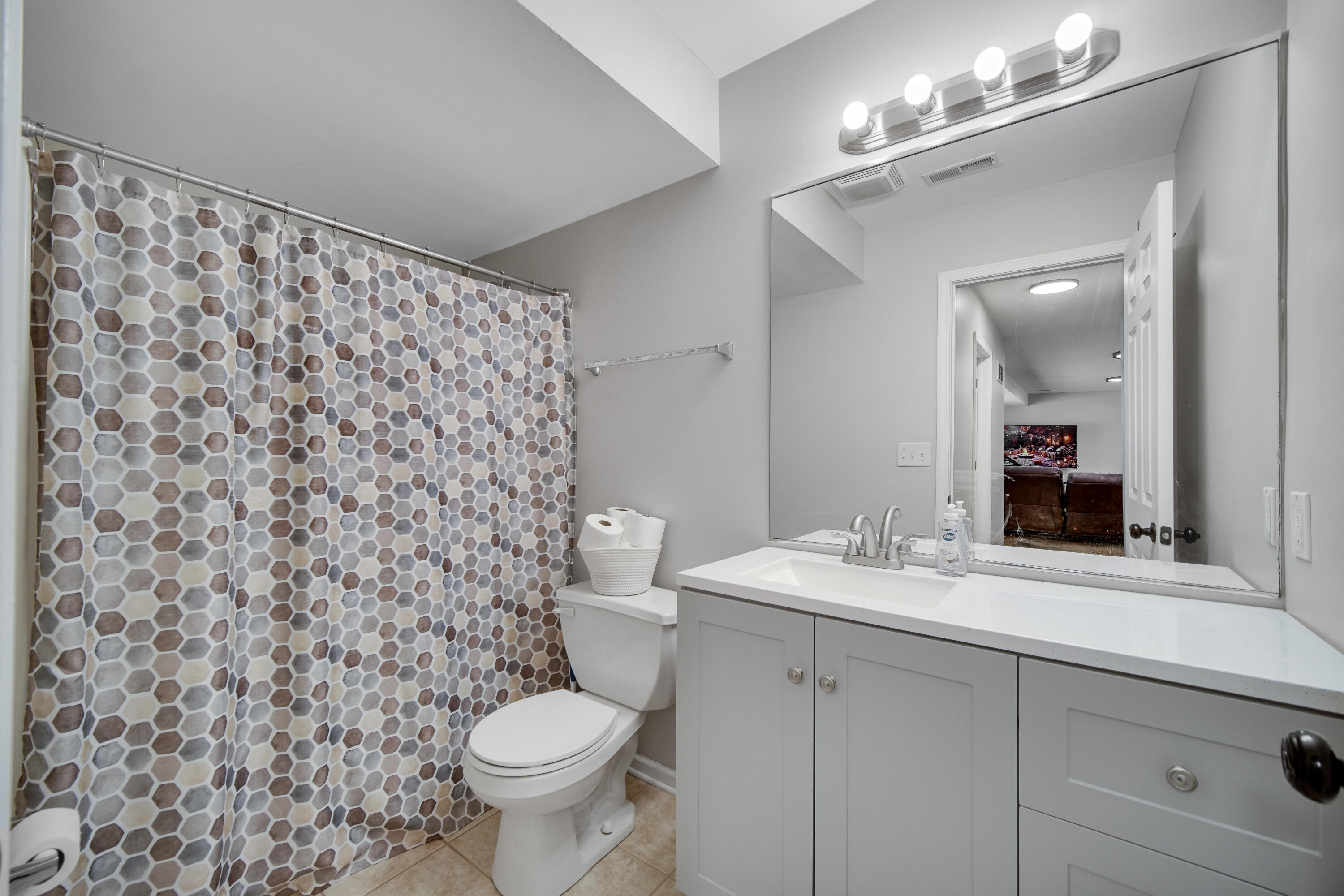 10487 Pinnacle Street Crown Point, IN 46307 - Photo 21 of 27 a bathroom with a sink toilet and a mirror
