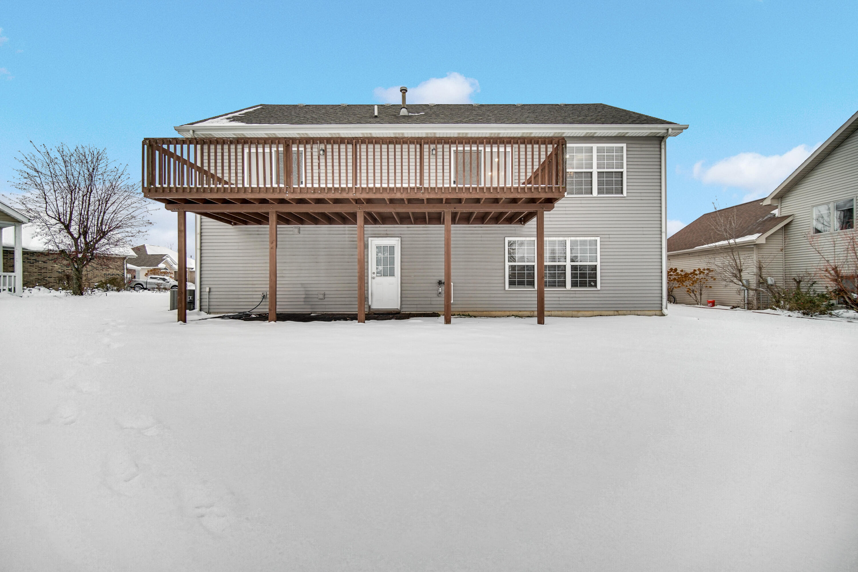 10487 Pinnacle Street Crown Point, IN 46307 - Photo 24 of 27 a view of a house with a wooden fence