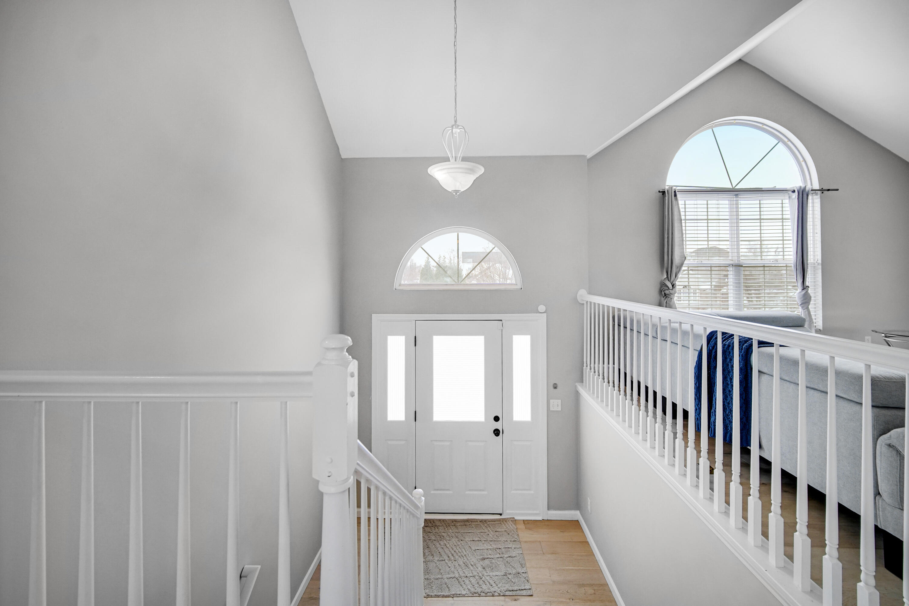 10487 Pinnacle Street Crown Point, IN 46307 - Photo 3 of 27 an empty room with wooden floor fan and windows