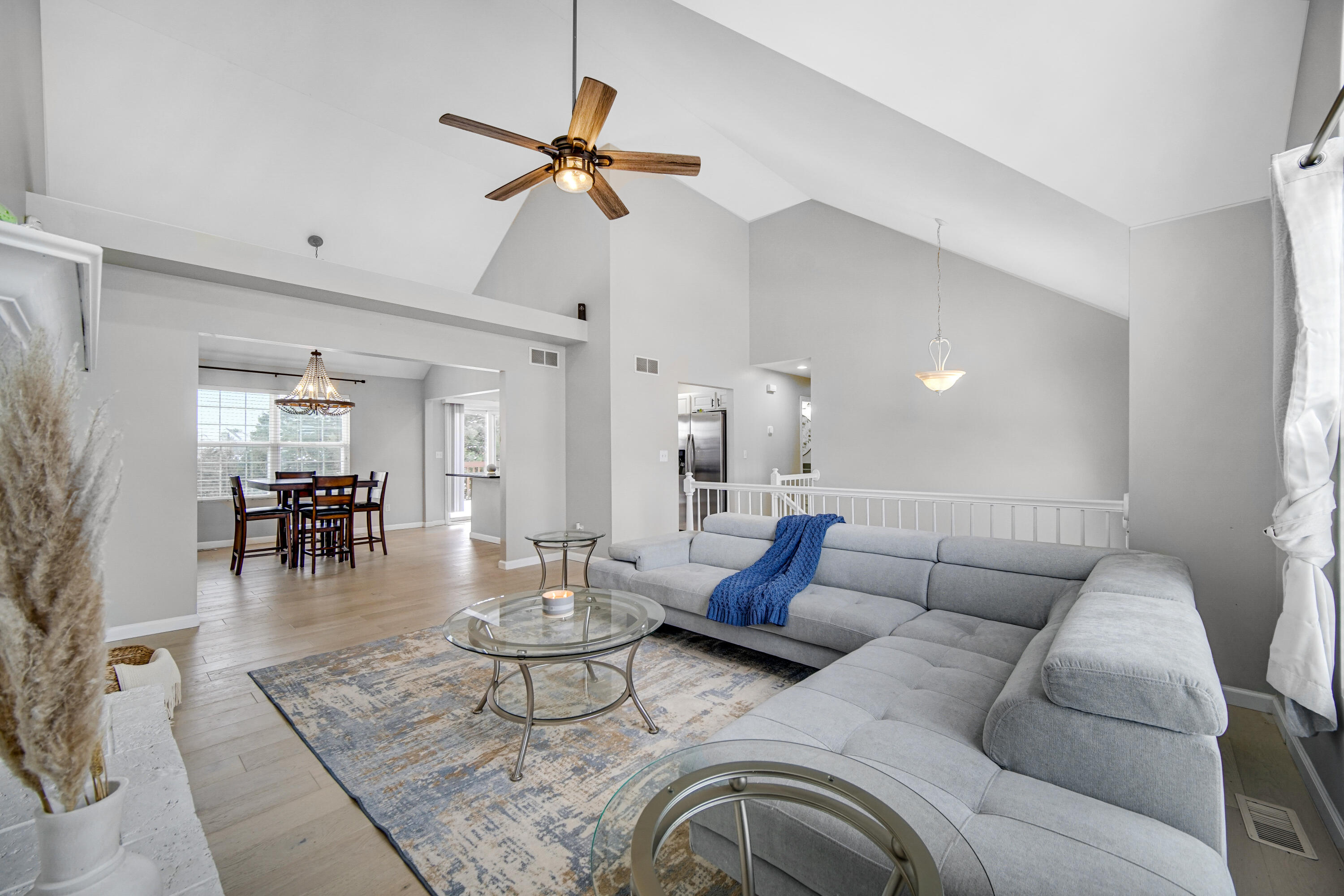 10487 Pinnacle Street Crown Point, IN 46307 - Photo 5 of 27 a living room with furniture and a wooden floor