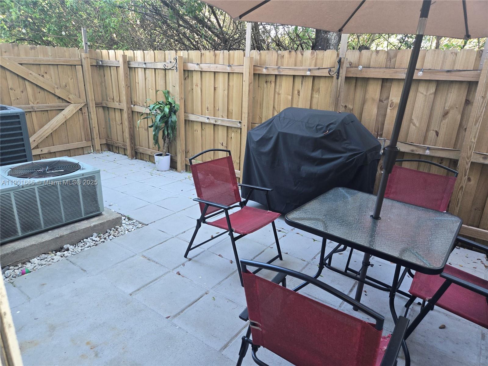 2731 Southeast 17th Avenue, Unit 100 Homestead, FL 33035 - Photo 12 of 12 a view of a balcony with furniture