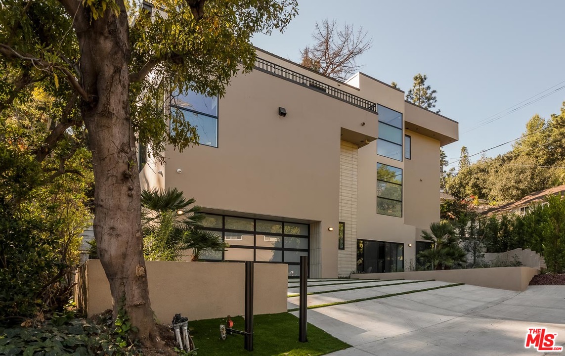 641 Elkins Road Los Angeles, CA 90049 - Photo 1 of 1 a front view of a house with plants