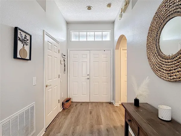 a view of a livingroom with furniture and wooden floor
