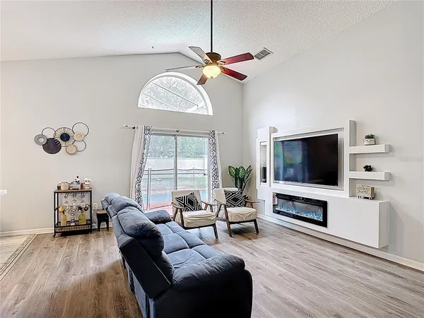 a living room with furniture and a flat screen tv