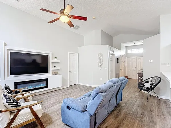 a living room with furniture and a flat screen tv