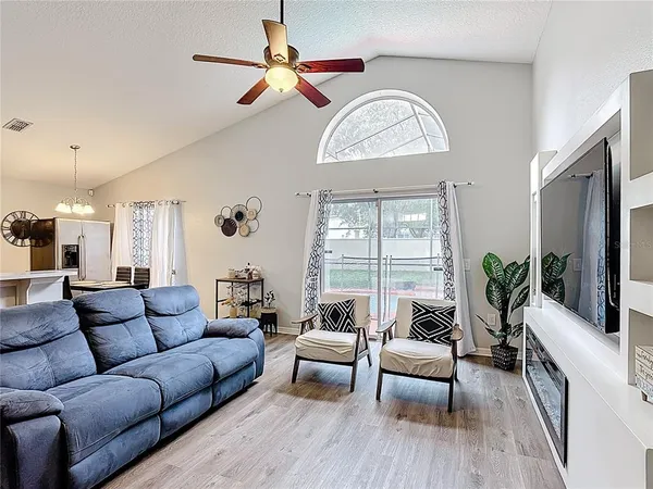 a living room with furniture and a large window