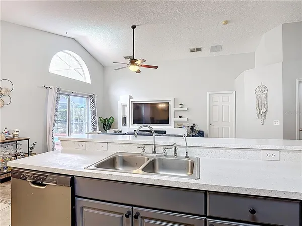 a kitchen with a sink and a refrigerator
