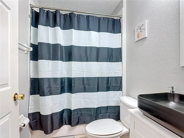 a bathroom with a sink and a toilet