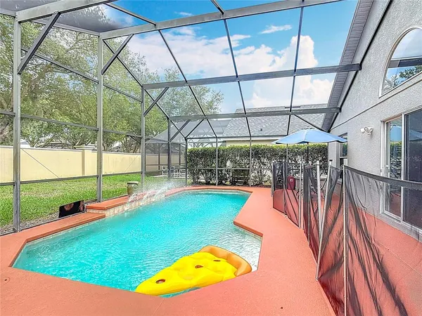 a view of swimming pool with a backyard