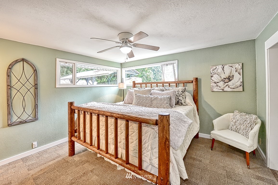 1177 West Axton Road Ferndale, WA 98248 - Photo 15 of 31 a bedroom with furniture and windows
