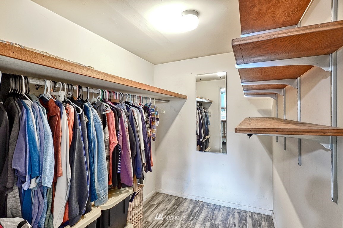 1177 West Axton Road Ferndale, WA 98248 - Photo 17 of 31 a view of walk in closet with clothes and shoes