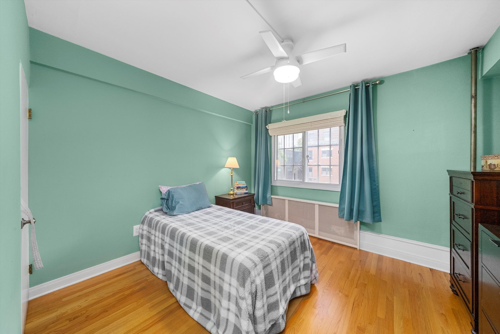 1157 East 56th Street, Unit 3 Chicago, IL 60637 - Photo 10 of 14 a bedroom with a bed and a window