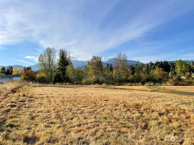 an aerial view of residential house and sandy dunes
