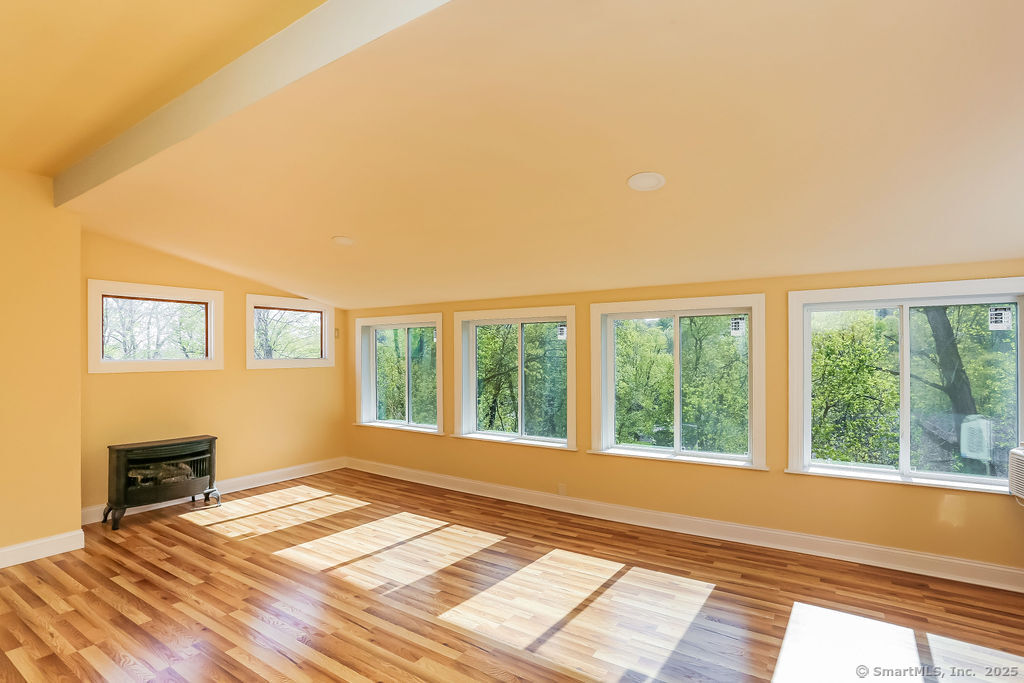 220 Walnut Street Winchester, CT 06098 - Photo 12 of 20 a view of empty room with wooden floor and fan