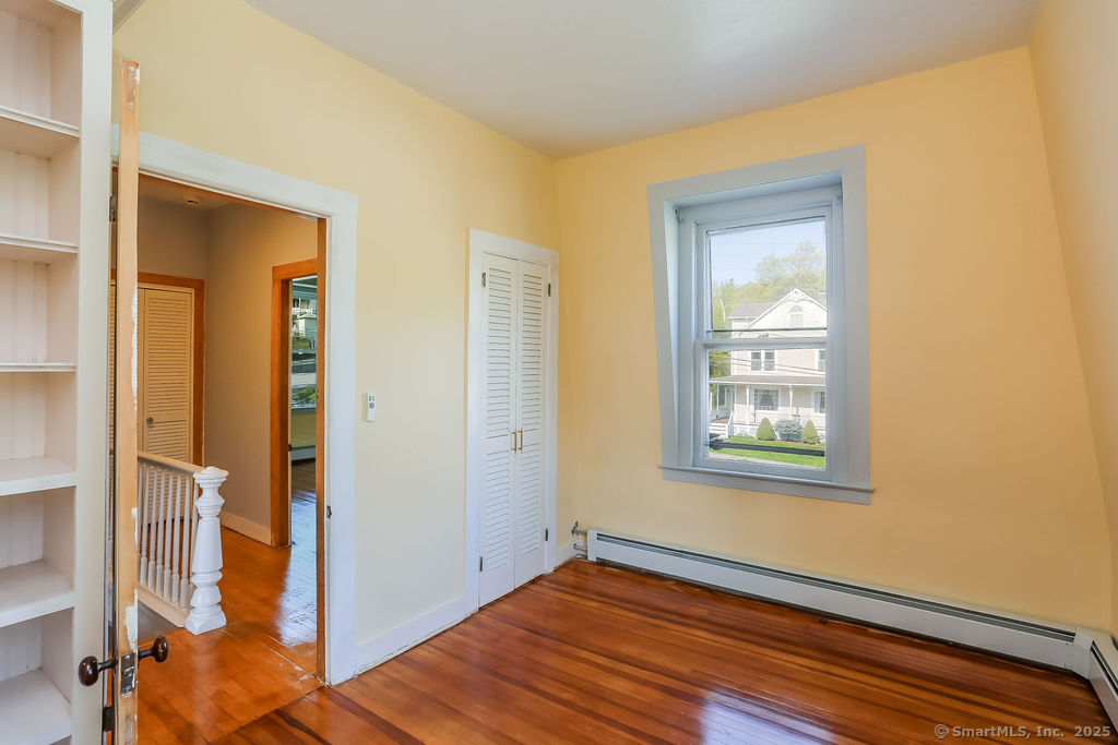 220 Walnut Street Winchester, CT 06098 - Photo 18 of 20 a view of an empty room with wooden floor and a window