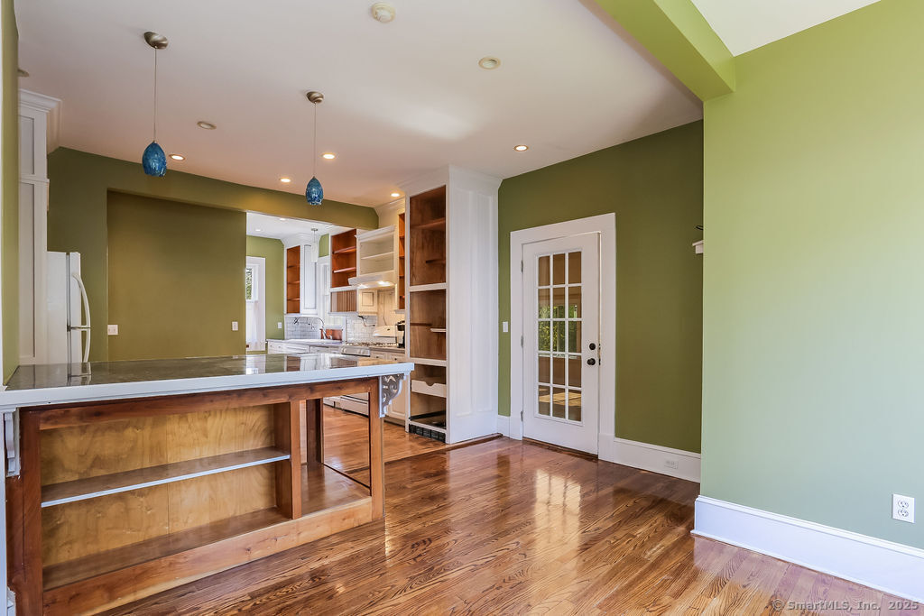 220 Walnut Street Winchester, CT 06098 - Photo 2 of 20 a view of a room with wooden floor and staircase