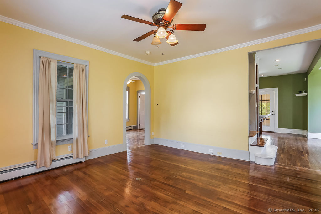 220 Walnut Street Winchester, CT 06098 - Photo 4 of 20 a view of an empty room with window and wooden floor