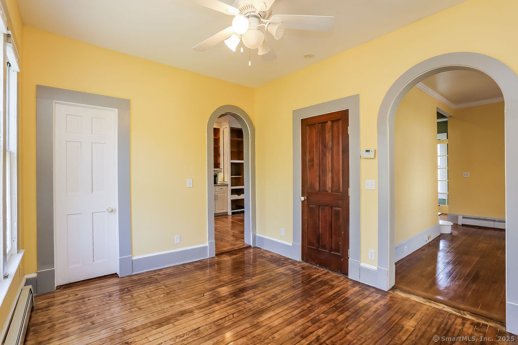 220 Walnut Street Winchester, CT 06098 - Photo 8 of 20 wooden floor in an empty room with a window
