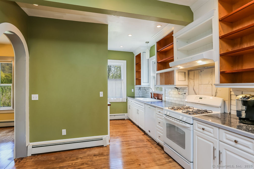 220 Walnut Street Winchester, CT 06098 - Photo 9 of 20 a kitchen with stainless steel appliances granite countertop a refrigerator and a stove