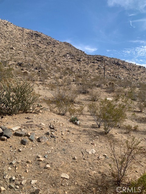 0 North Rimrock Apple Valley, CA 92307 - Photo 2 of 2 a view of a dry yard with mountains in the background