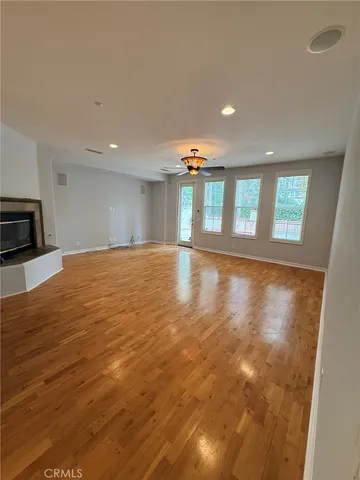 a view of an empty room with windows