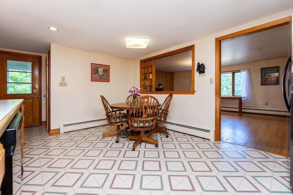 66 Depot Street Easton, MA 02375 - Photo 12 of 40 a view of a dining room with furniture and wooden floor