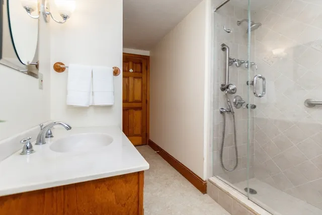 a bathroom with a sink and mirror