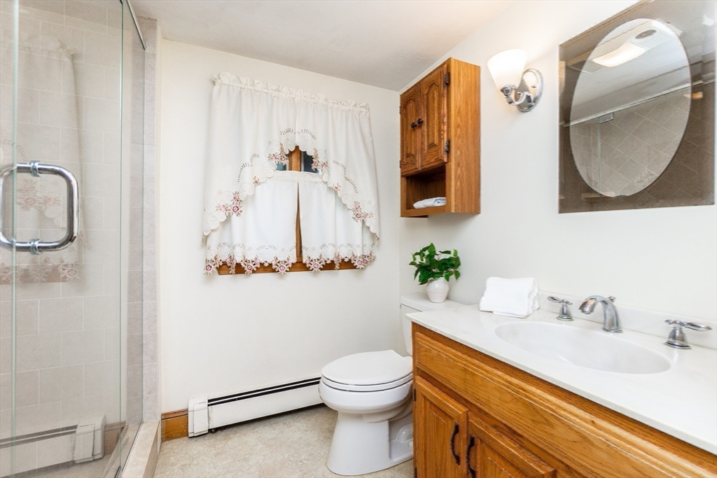 66 Depot Street Easton, MA 02375 - Photo 26 of 40 a bathroom with a toilet sink and mirror