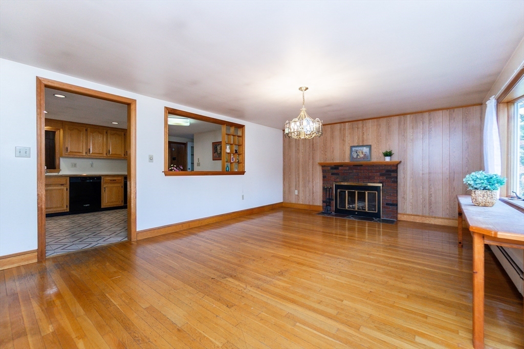 66 Depot Street Easton, MA 02375 - Photo 7 of 40 a view of livingroom with kitchen island furniture and wooden floor