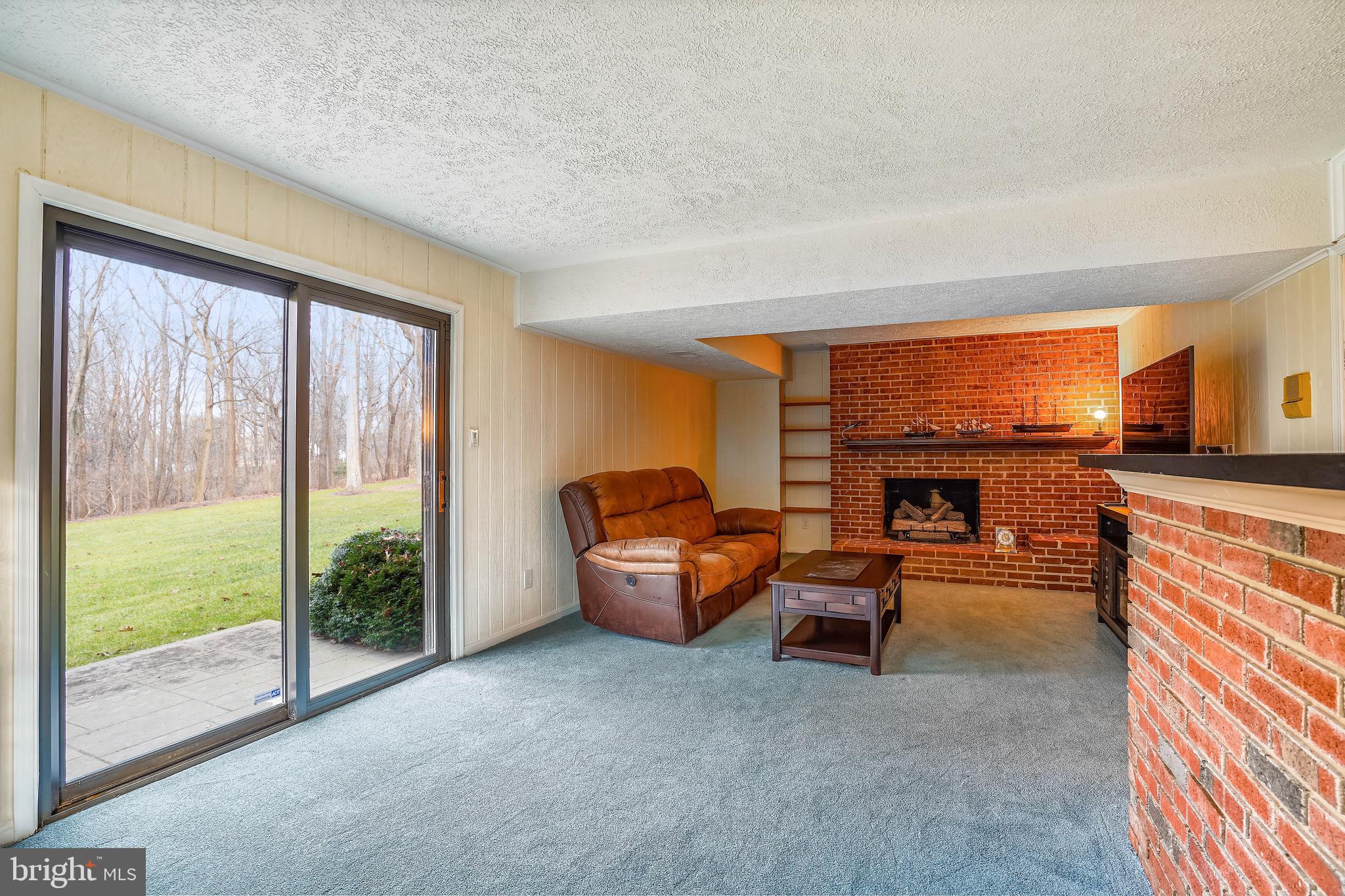 10412 Samaga Drive Oakton, VA 22124 - Photo 22 of 38 Recreation Room, SGD to yard, Gas Fireplace