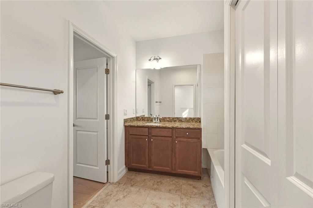 7770 Bristol Circle Naples, FL 34120 - Photo 20 of 36 Full bathroom with vanity and tub / shower combination