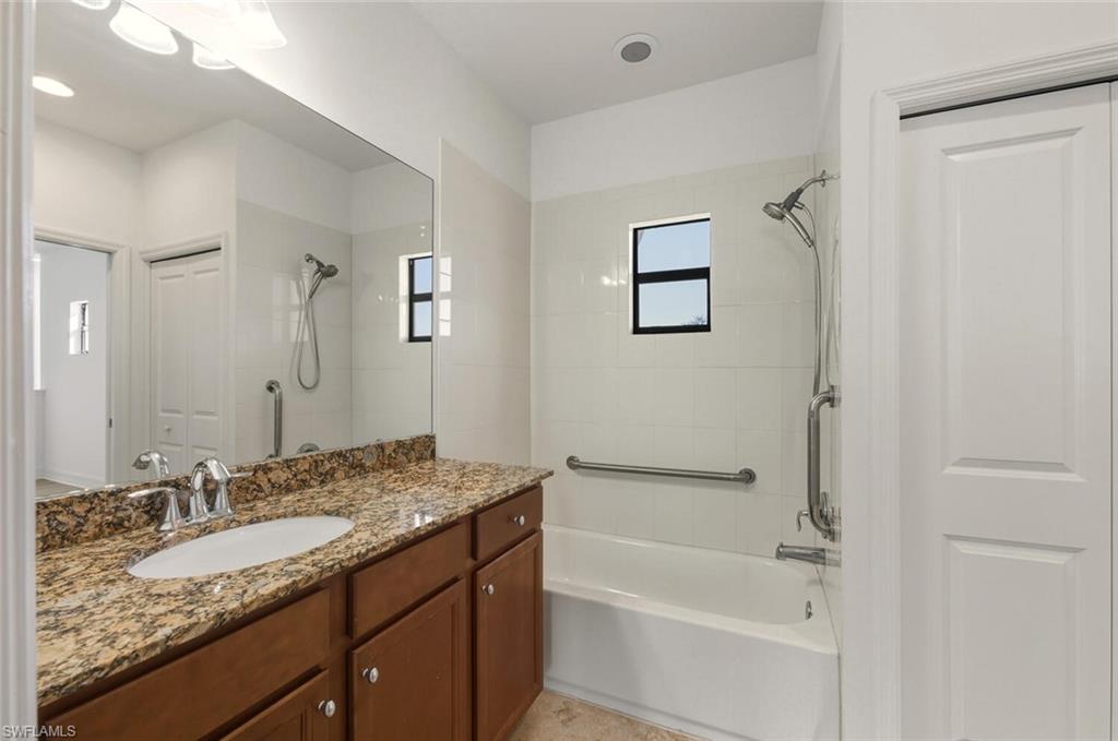 7770 Bristol Circle Naples, FL 34120 - Photo 21 of 36 Full bath featuring vanity, shower / washtub combination, and a closet