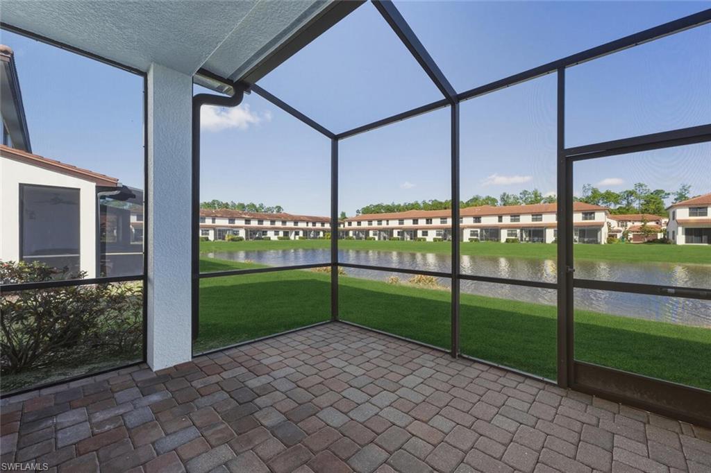 7770 Bristol Circle Naples, FL 34120 - Photo 24 of 36 Unfurnished sunroom featuring a water view
